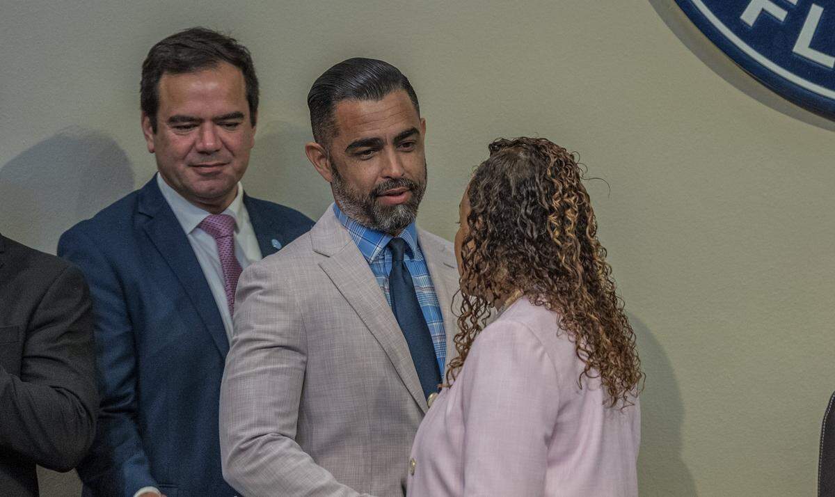 City of Miami Commissioner Ralph “Rafael” Rosado (left) and Citi Manager James Reyes greeted Chairwoman Christine King, ahead of a Miami City Commission meeting, at City Hall, on Thursday May 28, 2026.