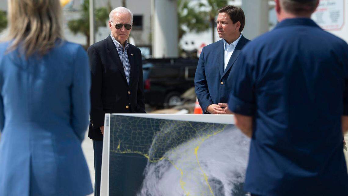 File photo of President Joe Biden, left, and Florida Gov. Ron DeSantis, right, in Fort Myers Beach on Oct. 5, 2022, to see the damage caused by Hurricane Ian. 
