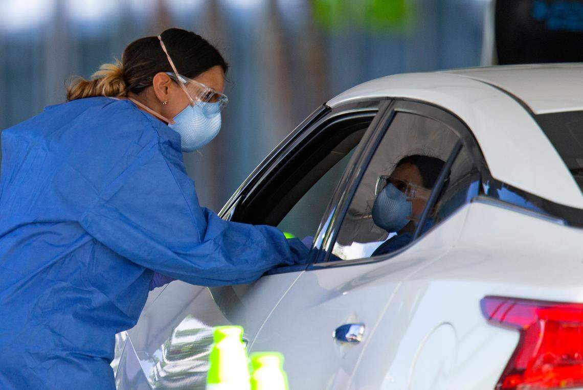 Vehicles line up for COVID-19 testing at the Miami Beach Convention Center on Wednesday, Oct. 28, 2020.