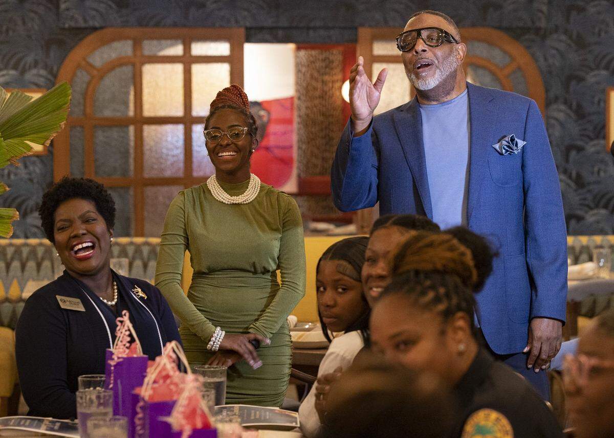 Ruban Roberts, Teen Talk founder, right, speaks with Ebony, center, and to the group during the Teen Talk etiquette luncheon Thursday, May 18, 2023, at Red Rooster in Overtown. “Ebony organized the all-girl Teen Talk because if I did it, that just wouldn’t be right,” said Roberts.