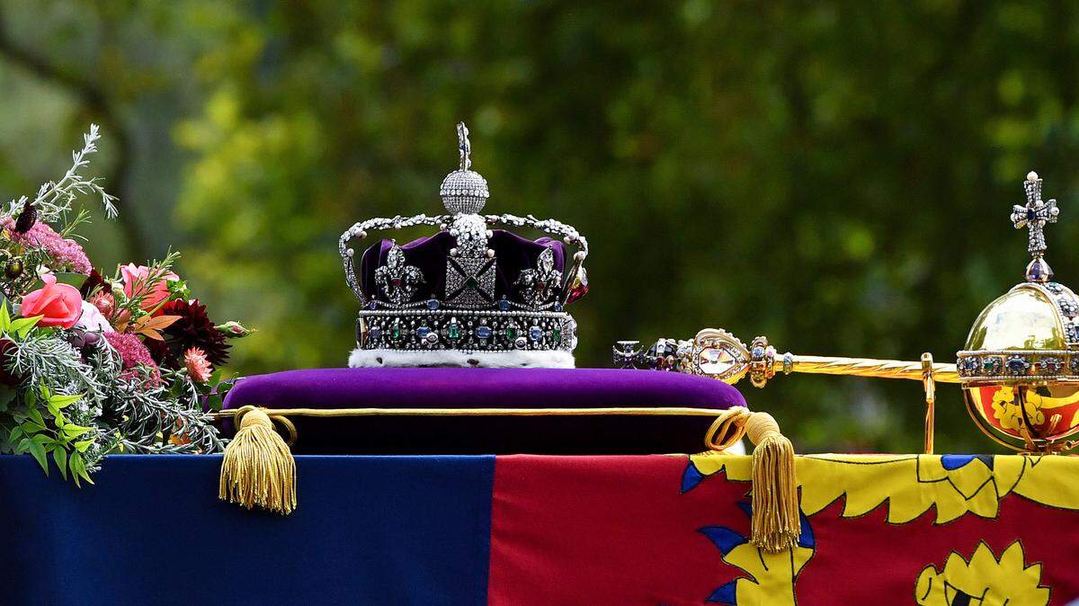 Queen Elizabeth II’s funeral and burial is taking place today at Windsor. Where will the Queen be buried? Whom will she be buried near? What will she wear?