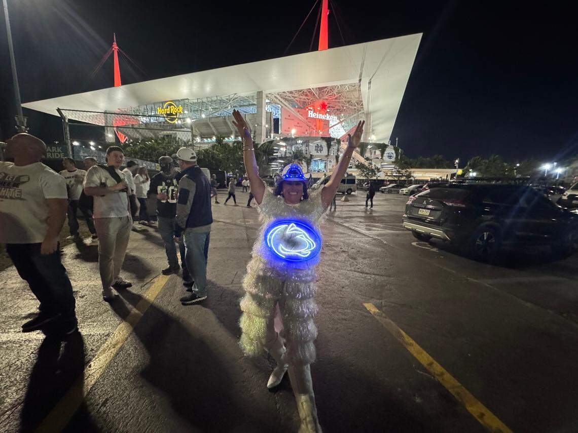Penn State fan Marice Leo celebrates outside of Hard Rock Stadium where her Nittany Lions will play the Notre Dame Fighting Irish in the College Football Playoff Semifinal at the Orange Bowl in Miami Gardens, Florida on Thursday, January 9, 2025. Leo specifically wore her tinsel outfit to coincide with PSU coach James Franklin’s call for a white out.