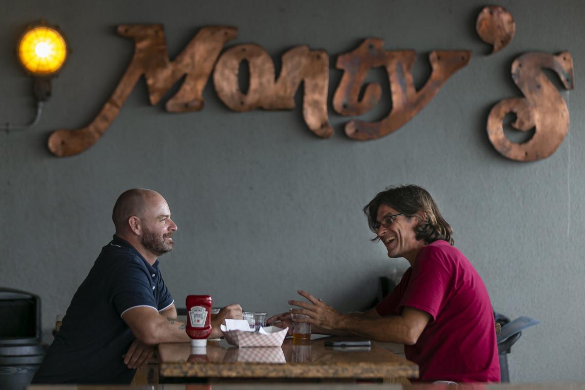 Ken Sain, 39, and Sean St. John, 36, visit Monty’s in Coconut Grove for the Friday night happy hour.