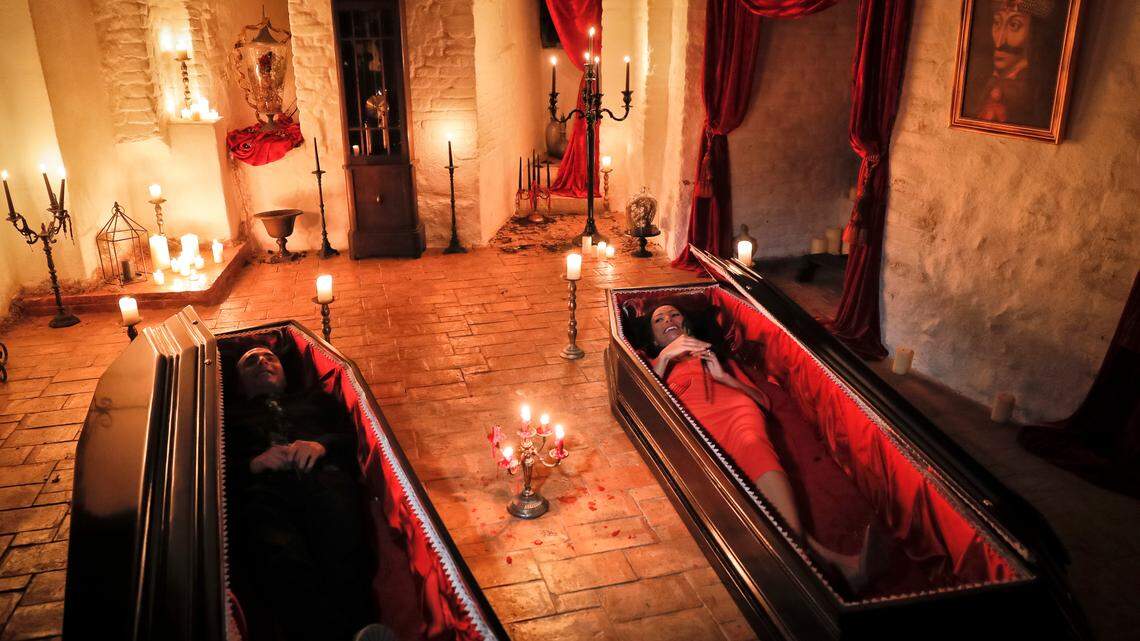 Tami Varma, right, and her brother Robin, the grandchildren of Devendra Varma — a scholar of English gothic tales and an expert in vampire lore — pose in coffins at the Bran Castle in Bran, Romania, on Oct. 31, 2016.