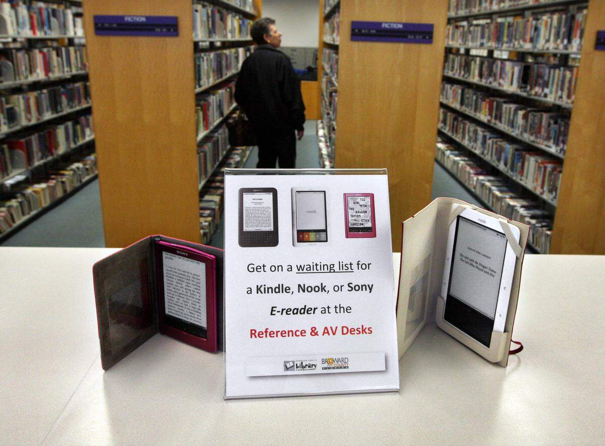 Old ways meet new ways at North Regional Library where dozens of e-books are available for borrowing like traditional books.