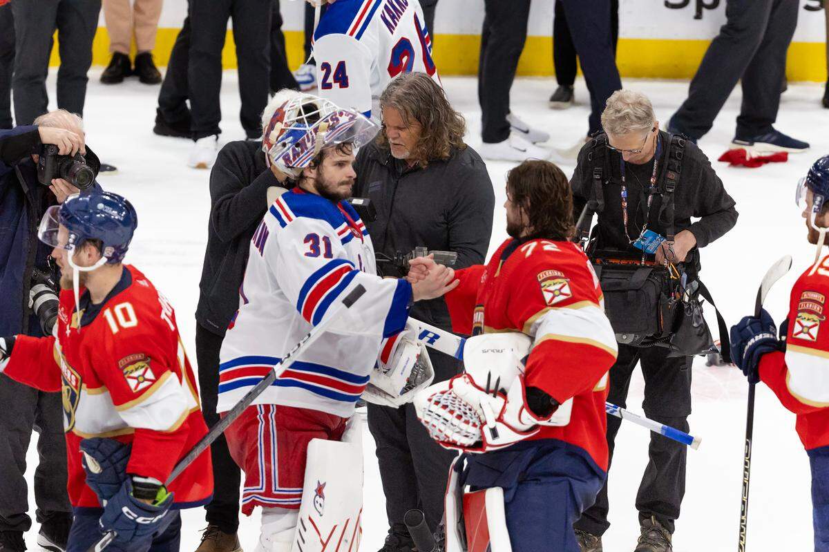 Florida Panthers goaltender Sergei Bobrovsky (72) and New York Rangers goaltender Igor Shesterkin (31) handshake after the Panthers  defeated the Rangers  in Game 6 during the Eastern Conference finals of the NHL hockey Stanley Cup playoffs at the Amerant Bank Arena on Saturday, June 1, 2024, in Sunrise, Fla.