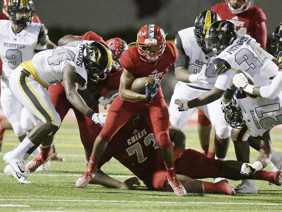 Cardinal Gibbons Chiefs’ running back Vincent Davis (5) carries the ball against American Heritage Patriots during the Region 4-5A final football game on Friday, Nov. 23, 2018 at Cardinal Gibbons High in Fort Lauderdale.