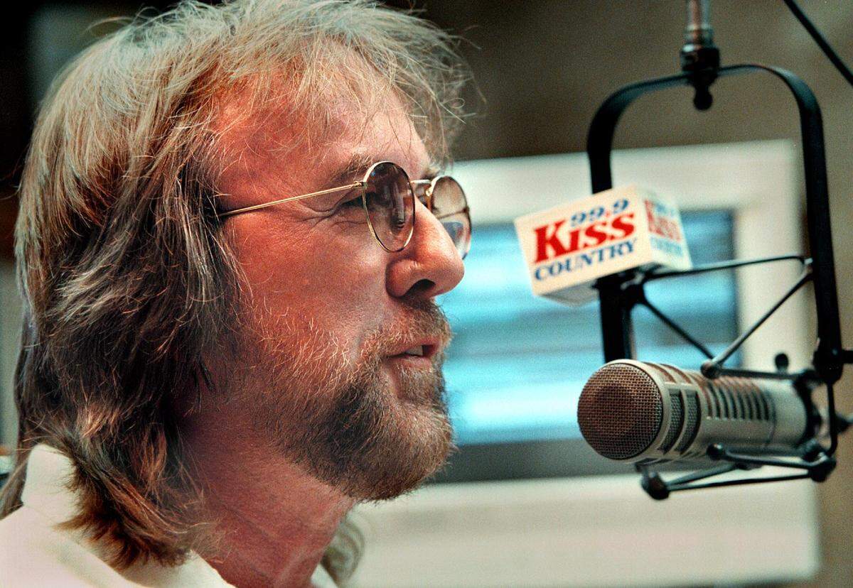 DJ Sonny Fox broadcasting his “Sonny in the Morning” show from the WKIS KISS Country radio station on July 21, 1999.