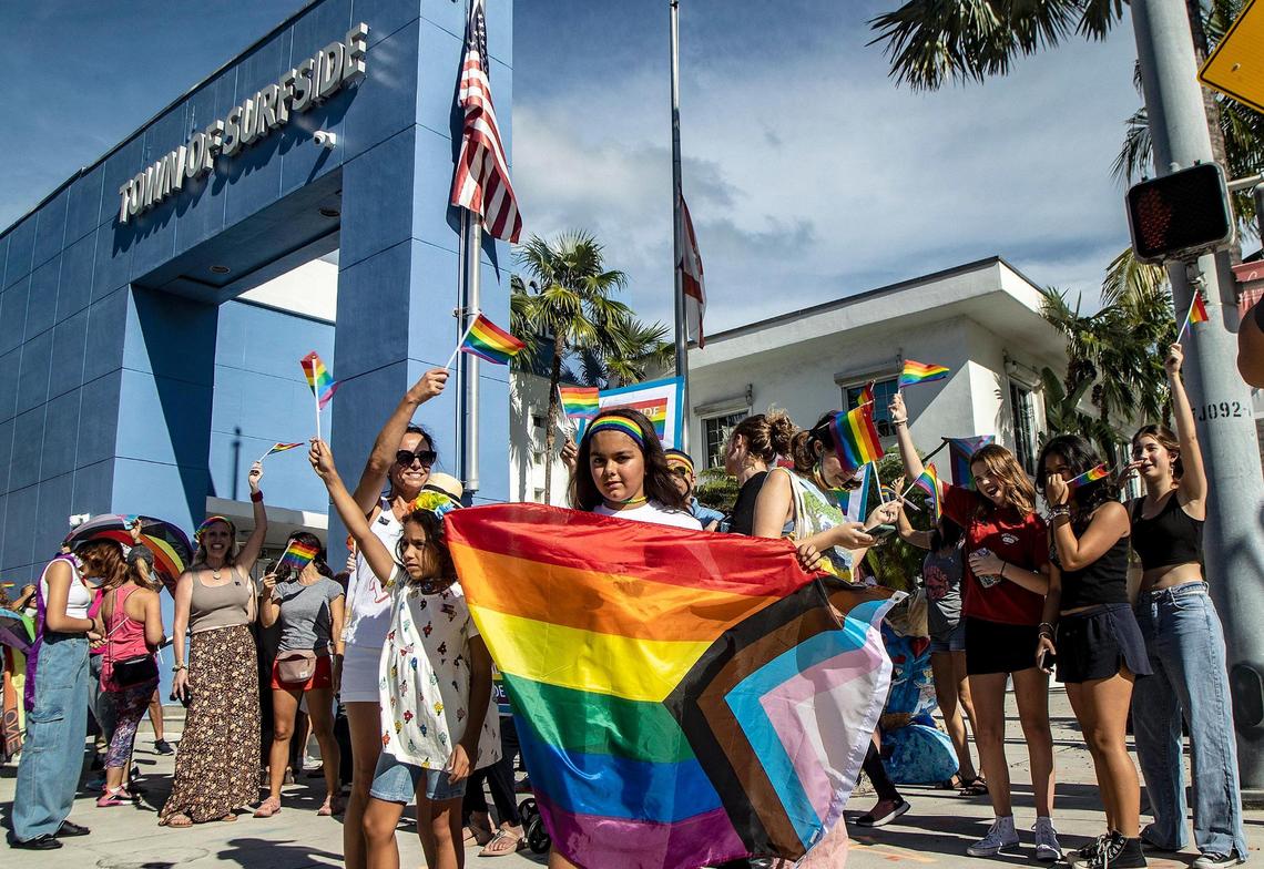 Michelle Arambula with her daughters Bianca (left) and Gia Arambula were among a group of Surfside residents who protested in front of Town Hall against the town’s decision not to fly the LGBTQ flag for Pride month on June 28, 2022.