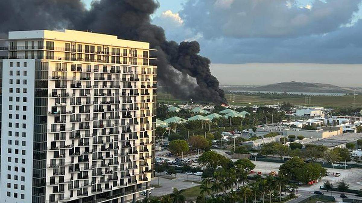 The smoke from a fire in April at the Miami-Dade Solid Waste recycling center, seen from a nearby neighborhood in Doral.