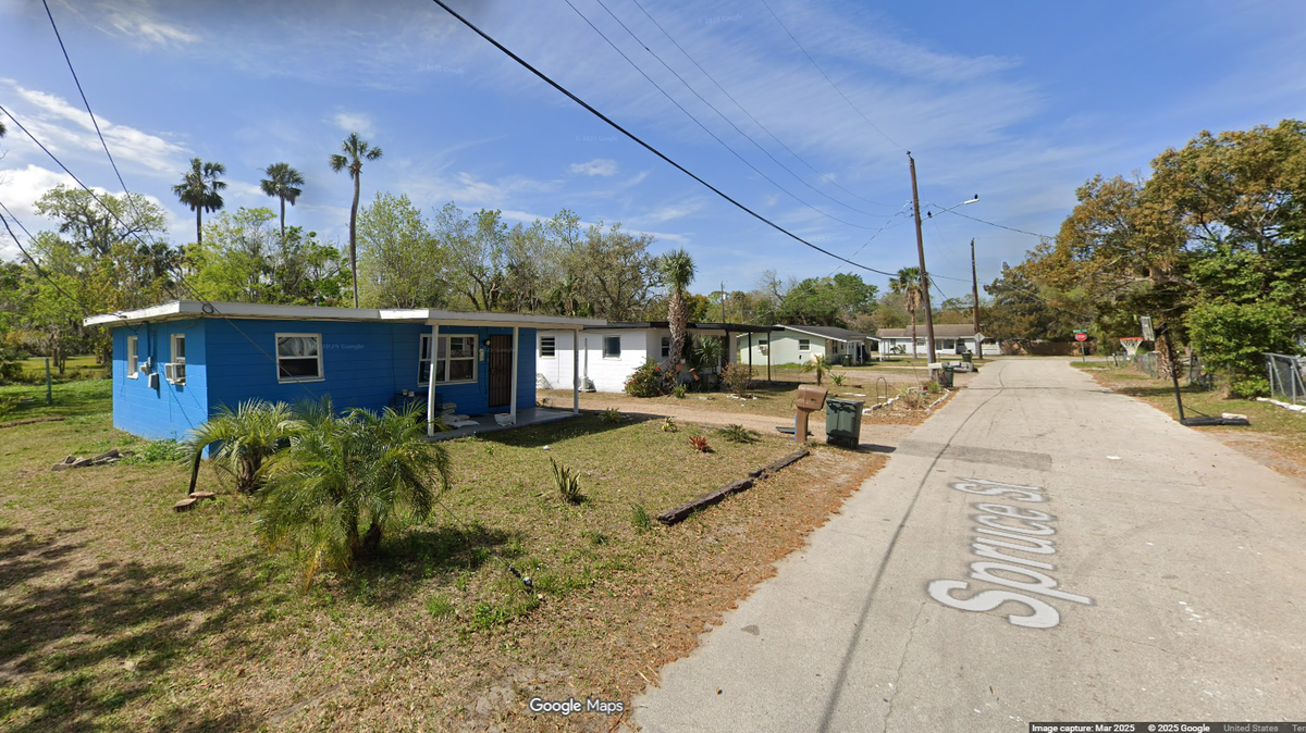 The dog attack happened in a home on Spruce Street in Daytona Beach, and the woman died at the scene, police said.
