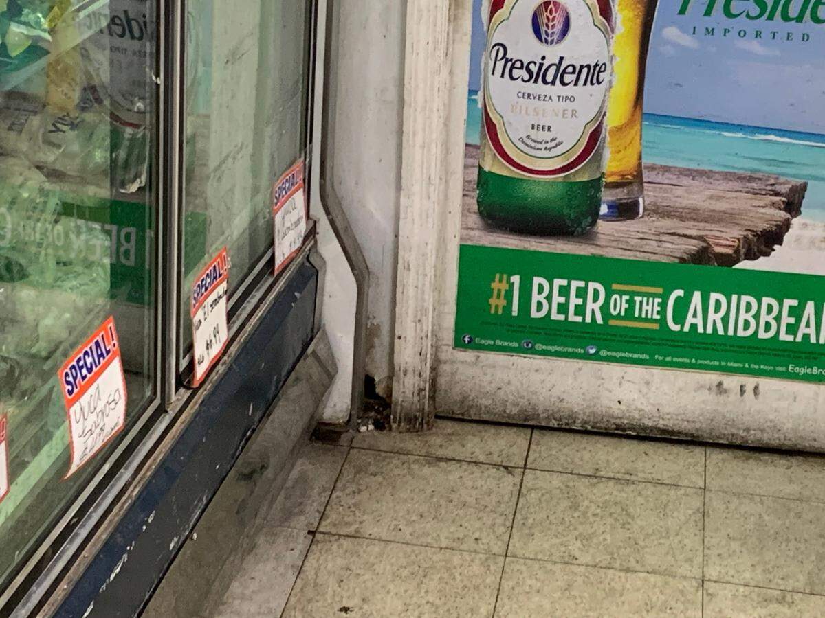 Another hole in the wall near the retail coolers at La Bodega Bestway Supermarket.