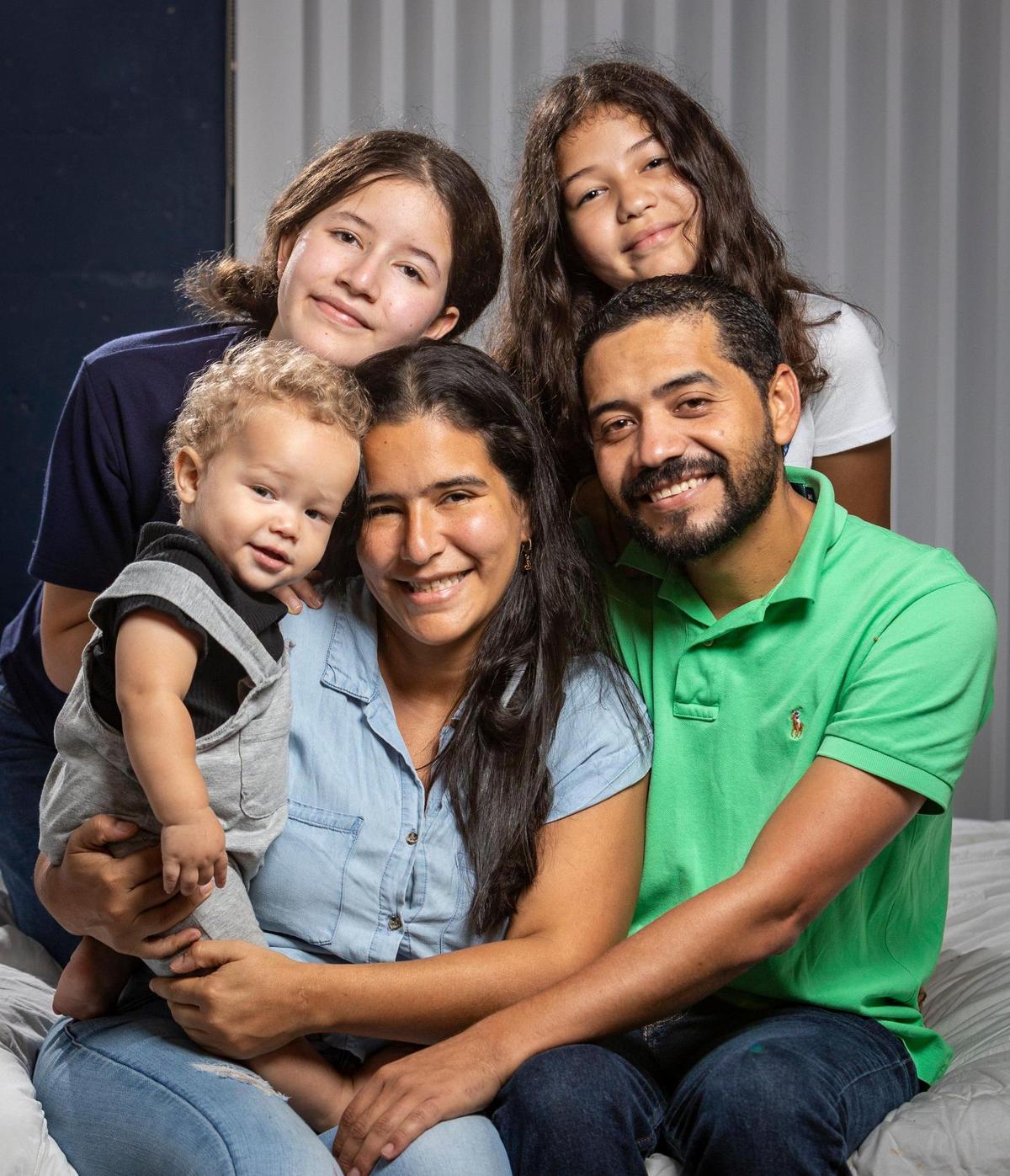 Edirson Azocar and his family came from Venezuela to Miami so he could get the heart surgery he needed. Clockwise starting bottom right: Edirson Azocar, Kimberly Lanz, Jake Azocar, Antonella Gomez and Edianela Azocar in their home in Miami.