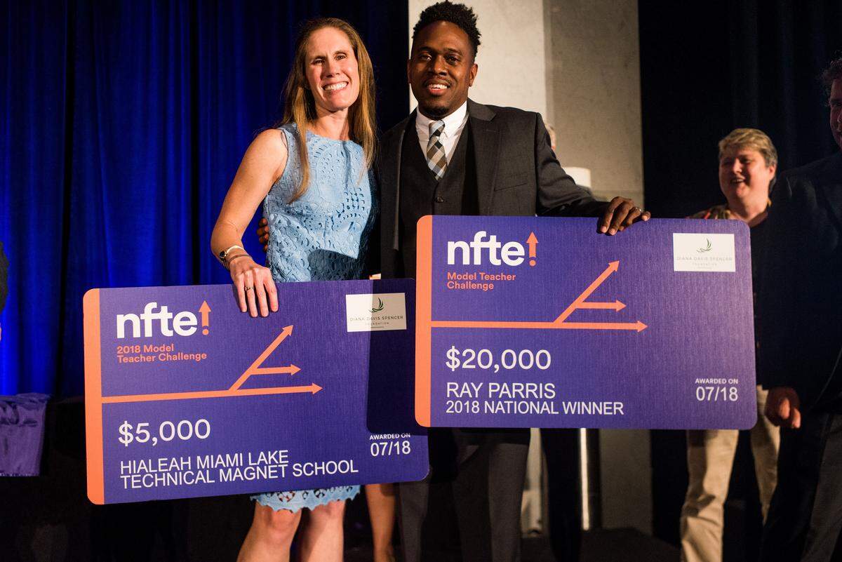Ray Parris, right, a teacher at Hialeah Miami Lakes Technical Magnet School, earned first place in the Network for Teaching Entrepreneurship’s Model Teacher Challenge. He is pictured with Jeannine Schloss, director of NFTE Florida.