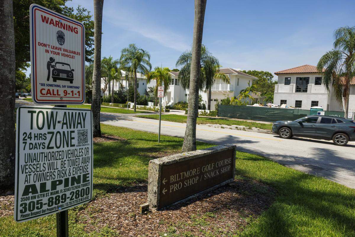 Warning signs sit at the entrance of the free parking lot outside the Biltmore Hotel during the day on Wednesday, Aug. 20, 2025, in Coral Gables, Fla.