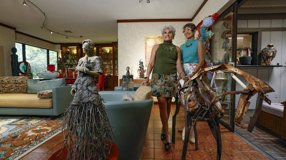 Donna Kass and Lisa Palley with their parents' art collection in the living room of the Palley family home in Miami on Wednesday, September 10, 2025.