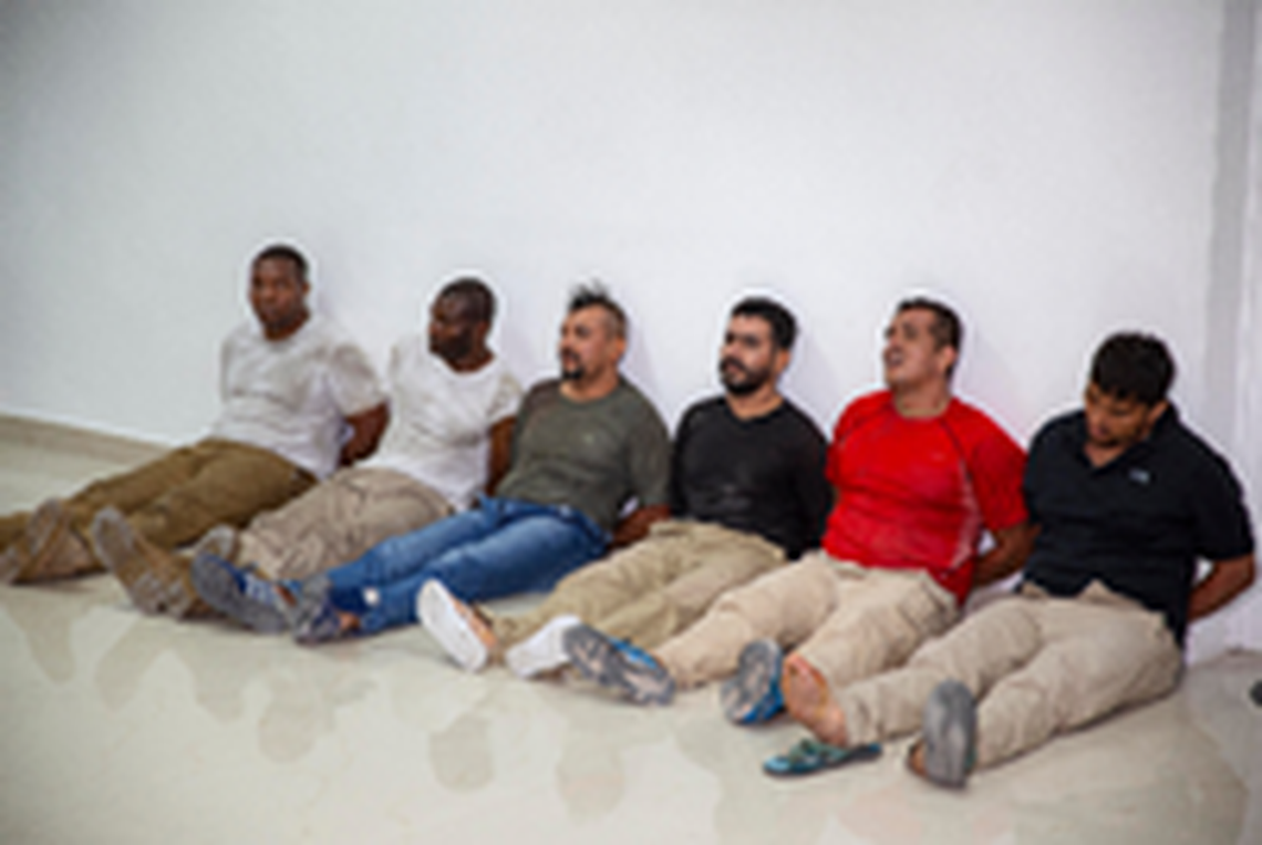 Suspects in the assassination of Haiti’s President Jovenel Moïse, among them Haitian-American citizens James Solages, left, and Joseph Vincent, second left, are shown to the media at the General Direction of the police in Port-au-Prince, Haiti, Thursday, July 8, 2021. Moïse was assassinated in an attack on his private residence early Wednesday.