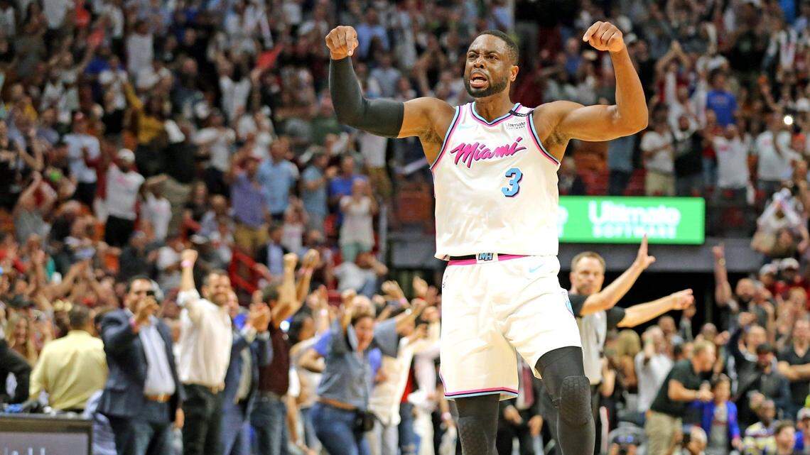 Miami Heat Dwyane Wade screams with the crowd after scoring the winning basket to defeat the Philadelphia 76ers in the final seconds at AmericanAirlines Arena.