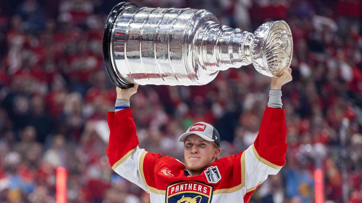 Florida Panthers center Anton Lundell (15) lifts the Stanley Cup after defeating the Edmonton Oilers in Game 7 of the Stanley Cup Final at Amerant Bank Arena on Monday, June 24, 2024, in Sunrise, Fla.