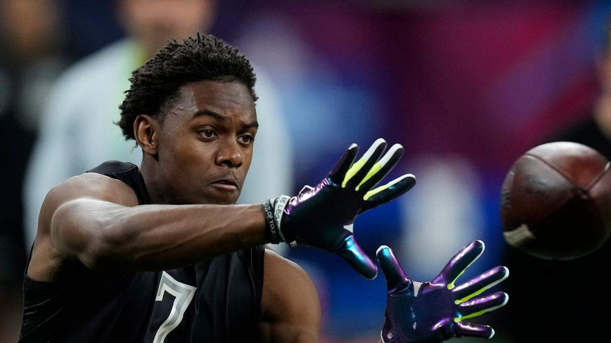 Penn State wide receiver Jahan Dotson catches a pass during a drill at the NFL football scouting combine, Thursday, March 3, 2022, in Indianapolis. (AP Photo/Charlie Neibergall)