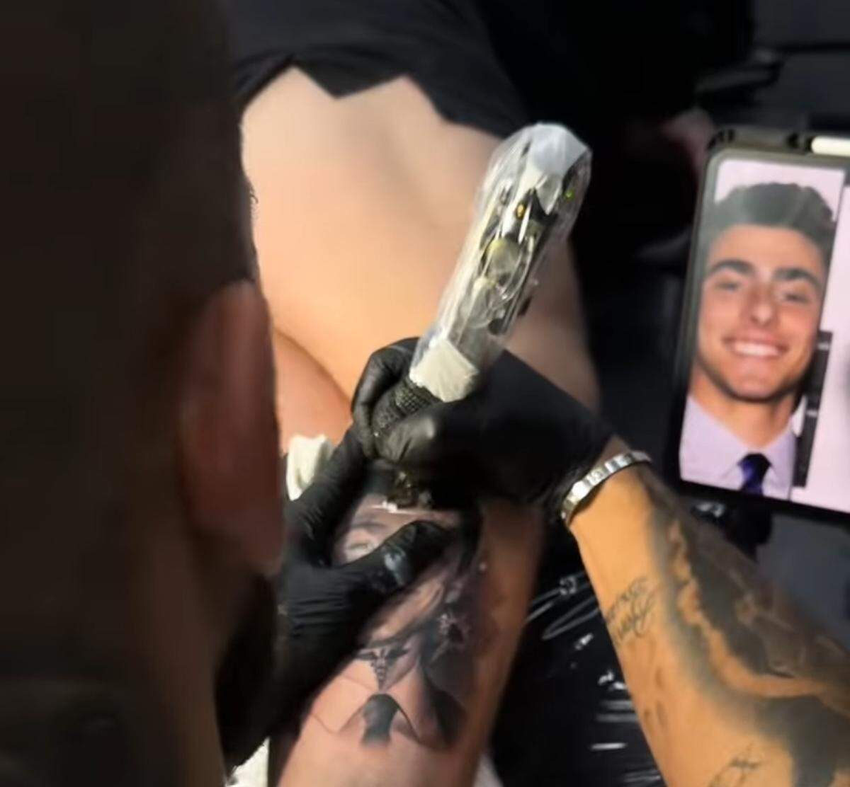 A screenshot of a video of Hollywood tattoo artist Anthony Medina tattooing a portrait of Luigi Mangione, the accused assassin of UnitedHealthcare CEO Brian Thompson, on a client’s leg. An Instagram post of the finished tattoo got over 1 million views in less than three days.