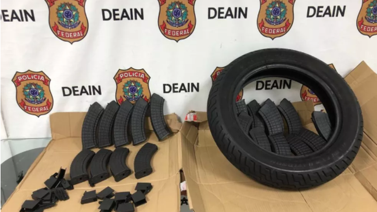 The Brazilian national police display a collection of seized firearm accessories that were shipped from Florida to the South American country. The Brazilians collaborated with Homeland Security Investigations in Miami to carry out the June 1, 2021, crackdown on the illicit weapons shipments.