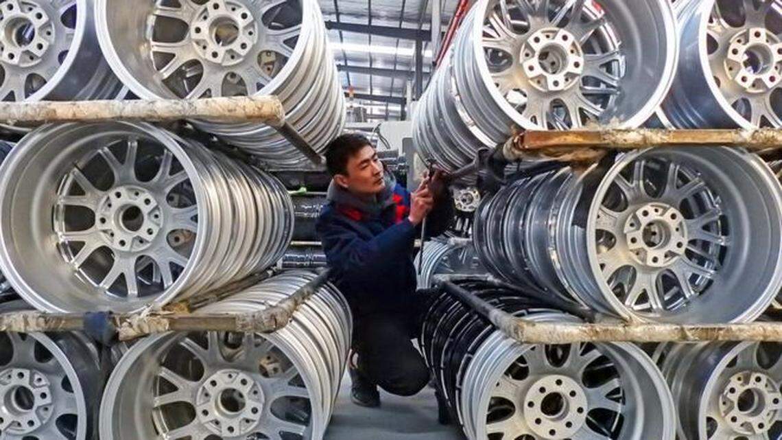 An employee works in a Chinese wheel factory.