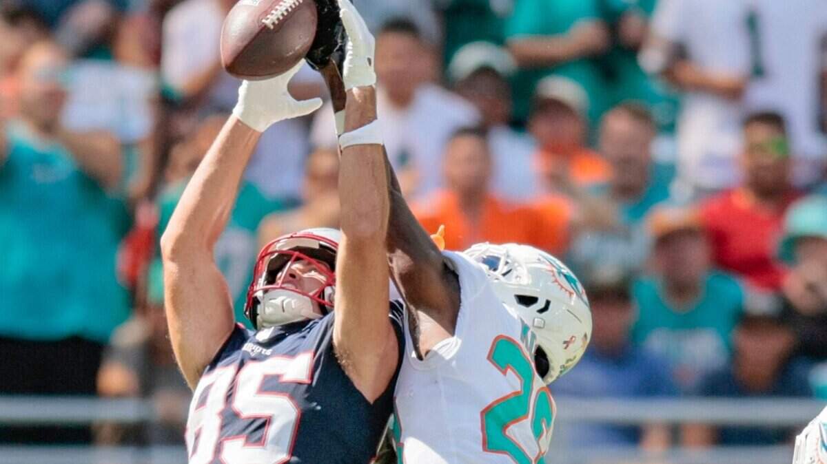 Miami Dolphins cornerback Kader Kohou (28) blocks a pass intended for New England Patriots tight end Hunter Henry (85) in the fourth quarter at Hard Rock Stadium in Miami Gardens on Sunday, September 11, 2022.