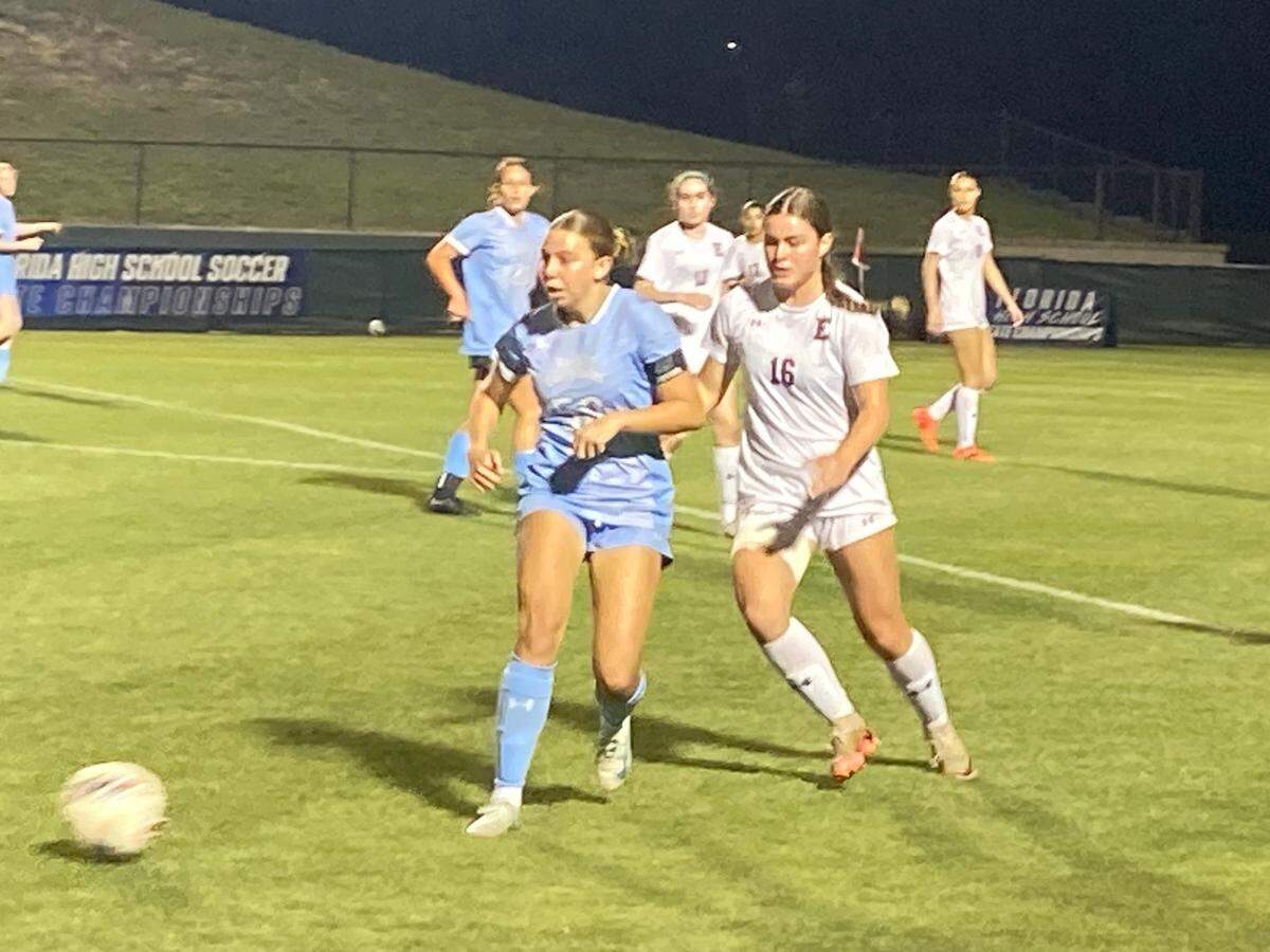 Ransom Everglades forward Stella Colombo (left) duels Episcopal’s Rivers Carney for a loose ball during Thursday night’s Class 2A state semifinal at Spec Martin Stadium in DeLand, Fla.