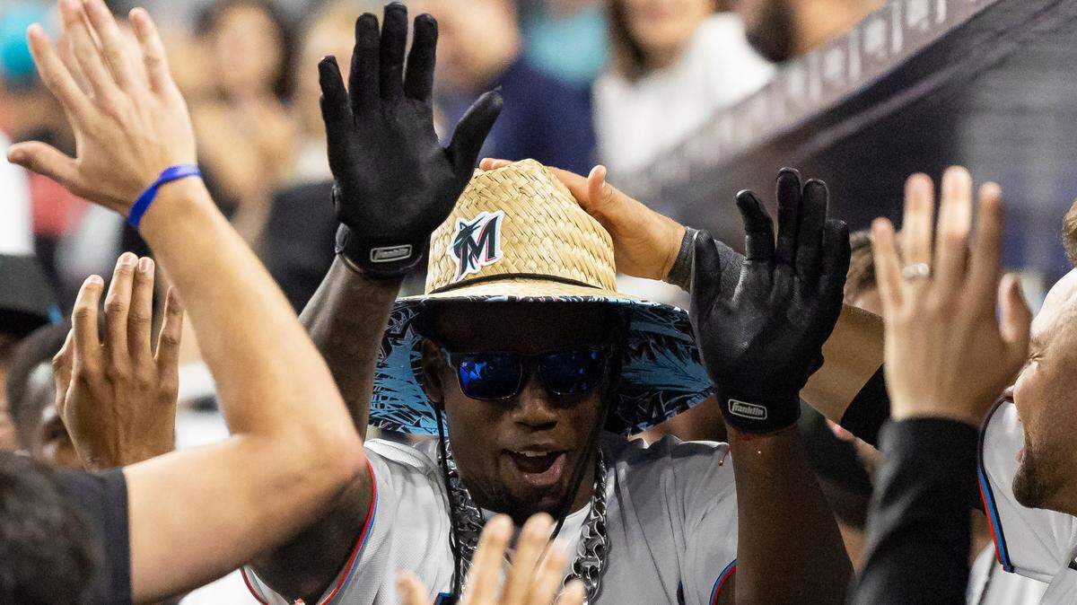 Miami Marlins left fielder Jorge Soler (12) celebrates with his teammates after scoring a home run against the San Francisco Giants in the seventh inning of an MLB game at loanDepot park on Monday, April 17, 2023, in Miami, Fla.