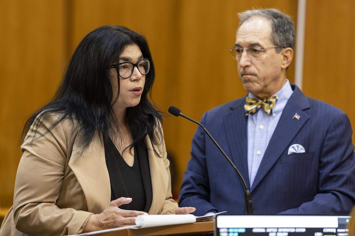 Former Miami-Dade School Board member Lubby Navarro, flanked by her attorney, Ben Kuehne, speaks during her plea hearing at the Richard E. Gerstein Justice Building on Tuesday, April 14, 2026, in Miami, Fla. Navarro plead guilty to spending up to $100,000 of district funds while in office.