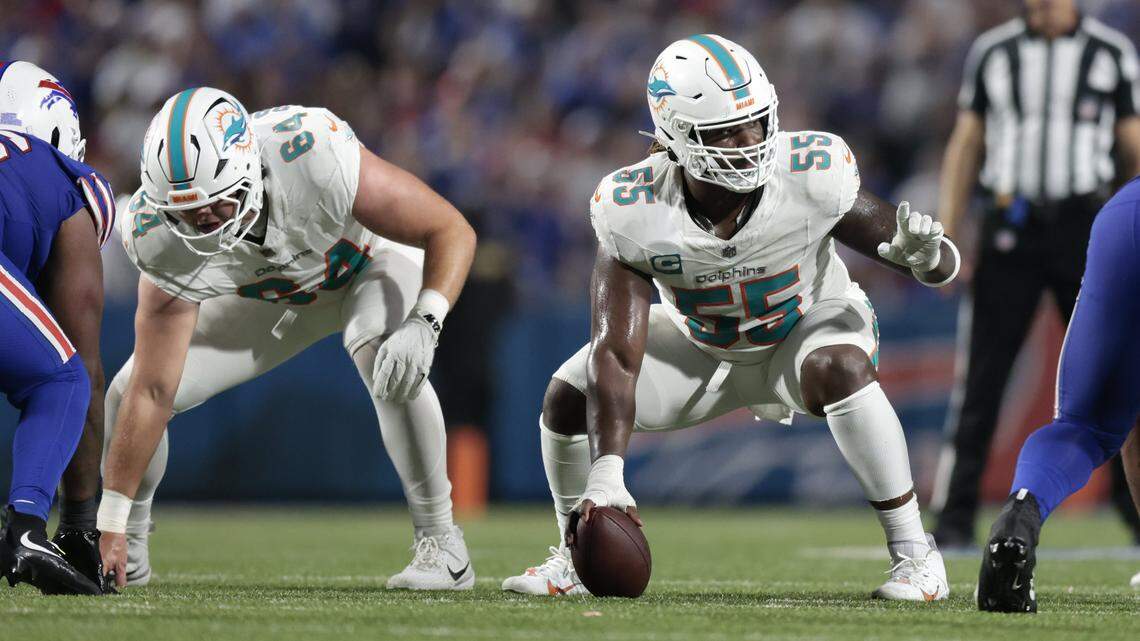 Miami Dolphins center Aaron Brewer (55) and offensive tackle Daniel Brunskill (64) set up as they prepare for an offensive play in the second half of the NFL football game against the Buffalo Bills at Highmark Stadium in Orchard Park, NY, on Thursday, September 18, 2025.