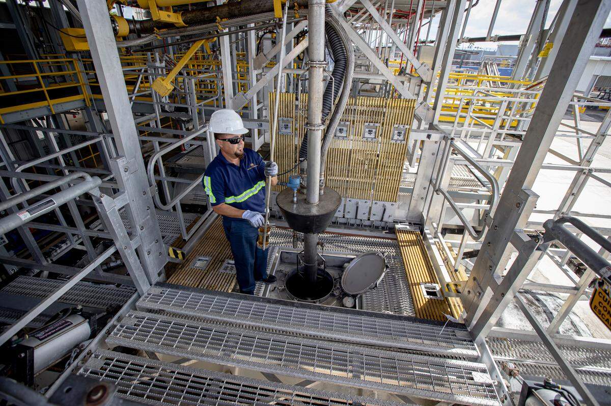 A worker at the Bacardi rum factory in Puerto Rico. The plant, which produces 200 million bottles of rum a year, is tweaking its production line to produce ethanol used in hand sanitizers, amid the global COVID-19 crisis.