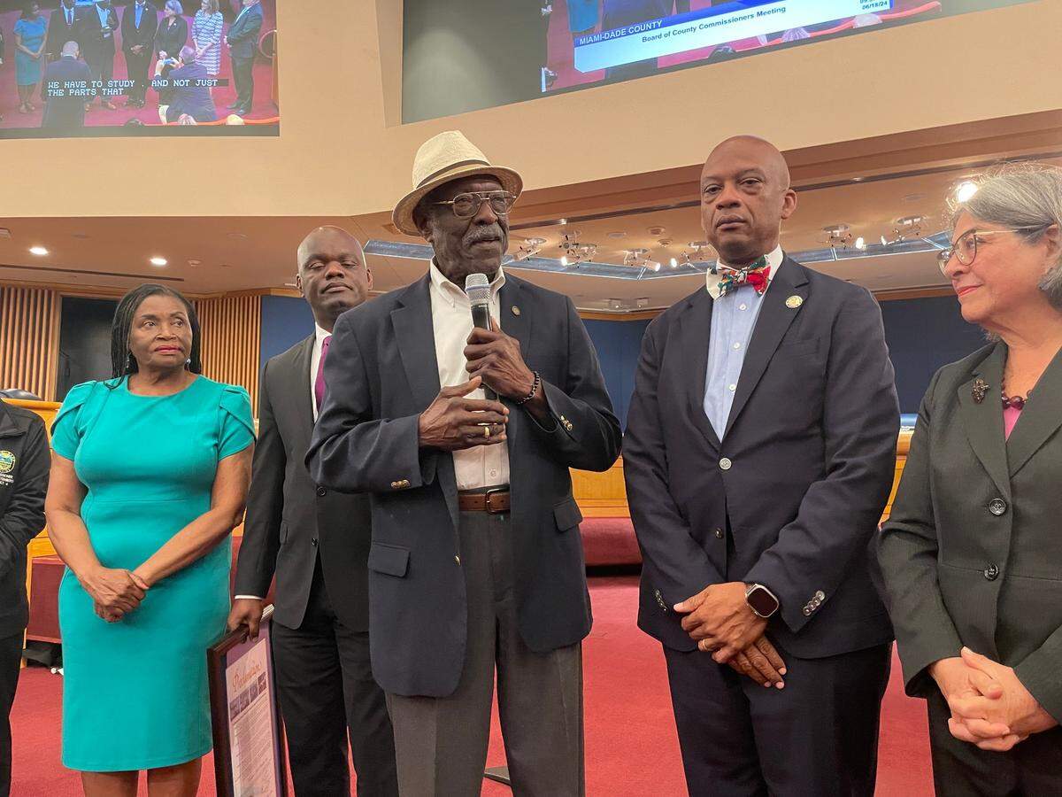 Wilbur Bell addresses the audience at the Miami-Dade County Commission on Tuesday, June 18, 2024, after receiving a proclamation honoring his family history. The presentation followed a CNN segment on Bell’s quest to document his father was born into slavery in 1865 in Georgia. Behind Bell, from left to right, are County Commissioners Marleine Bastien, Kionne McGhee and Oliver Gilbert, and the county’s mayor, Daniella Levine Cava.