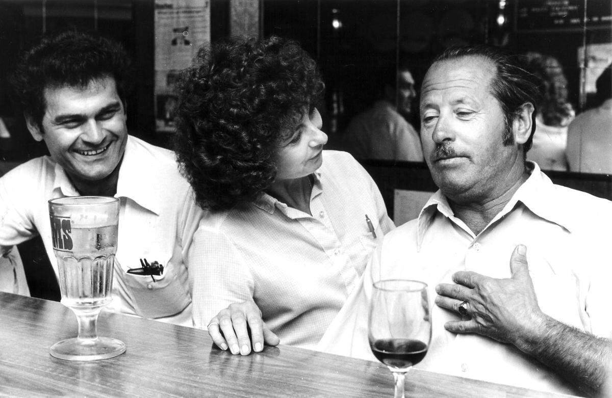 In 1981, regular customers chat over liquid refreshments.