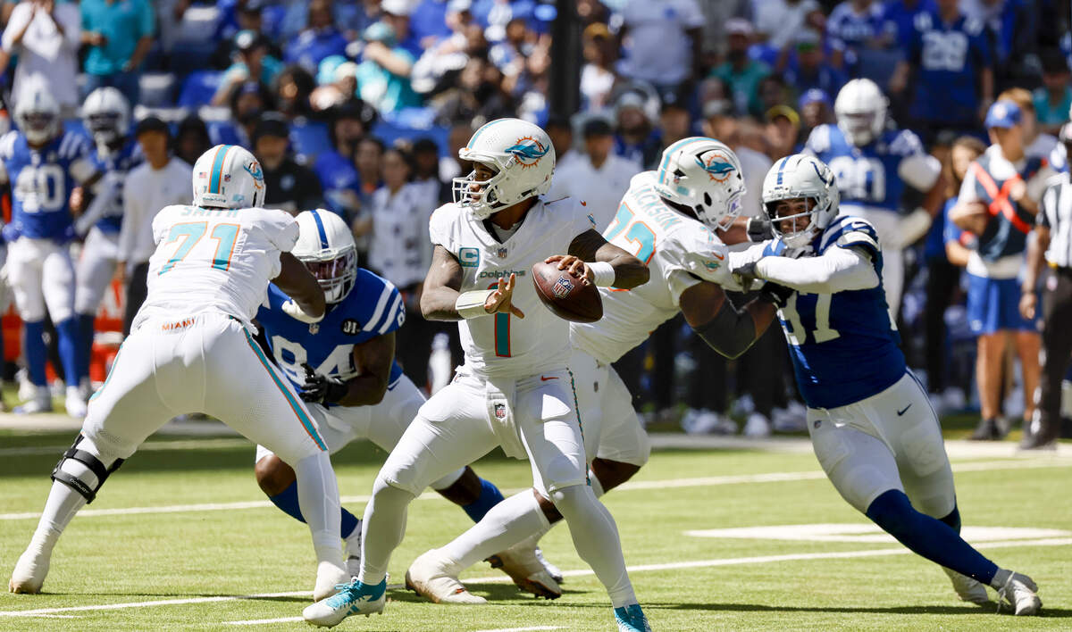 Miami Dolphins quarterback Tua Tagovailoa (1) prepares to throw during the first half of an NFL game against the Indianapolis Colts during the first half of an NFL game against Indianapolis Colts at Lucas Oil Stadium on Sunday, September 7, 2025, in Indianapolis, Indiana.