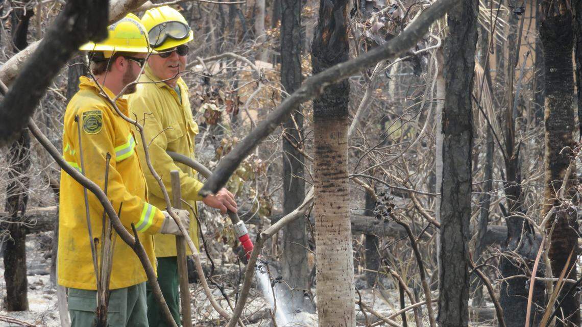 Firefighters work on the Big Pine Key brush fire on April 26, 2018. The fire broke out April 22.