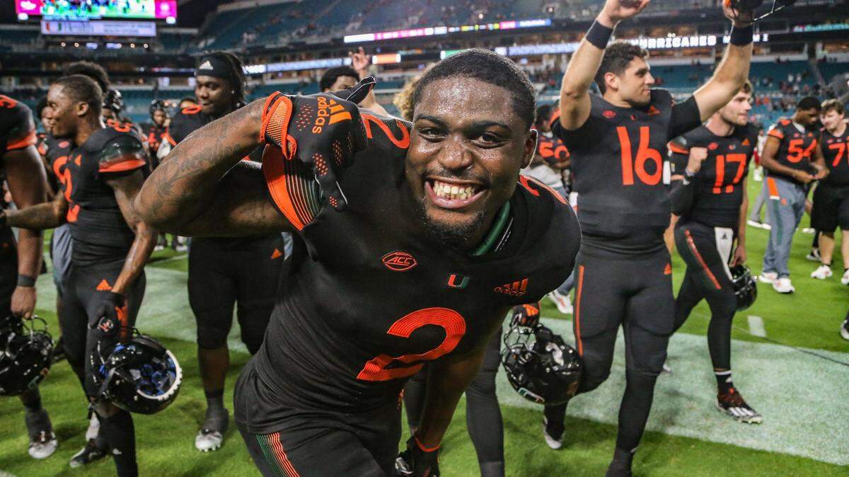 Miami Hurricanes cornerback Tyrique Stevenson (2) celebrates with teammates after defeating North Carolina State Wolfpack 31-30 at Hard Rock Stadium in Miami Gardens on Saturday, October 23, 2021.