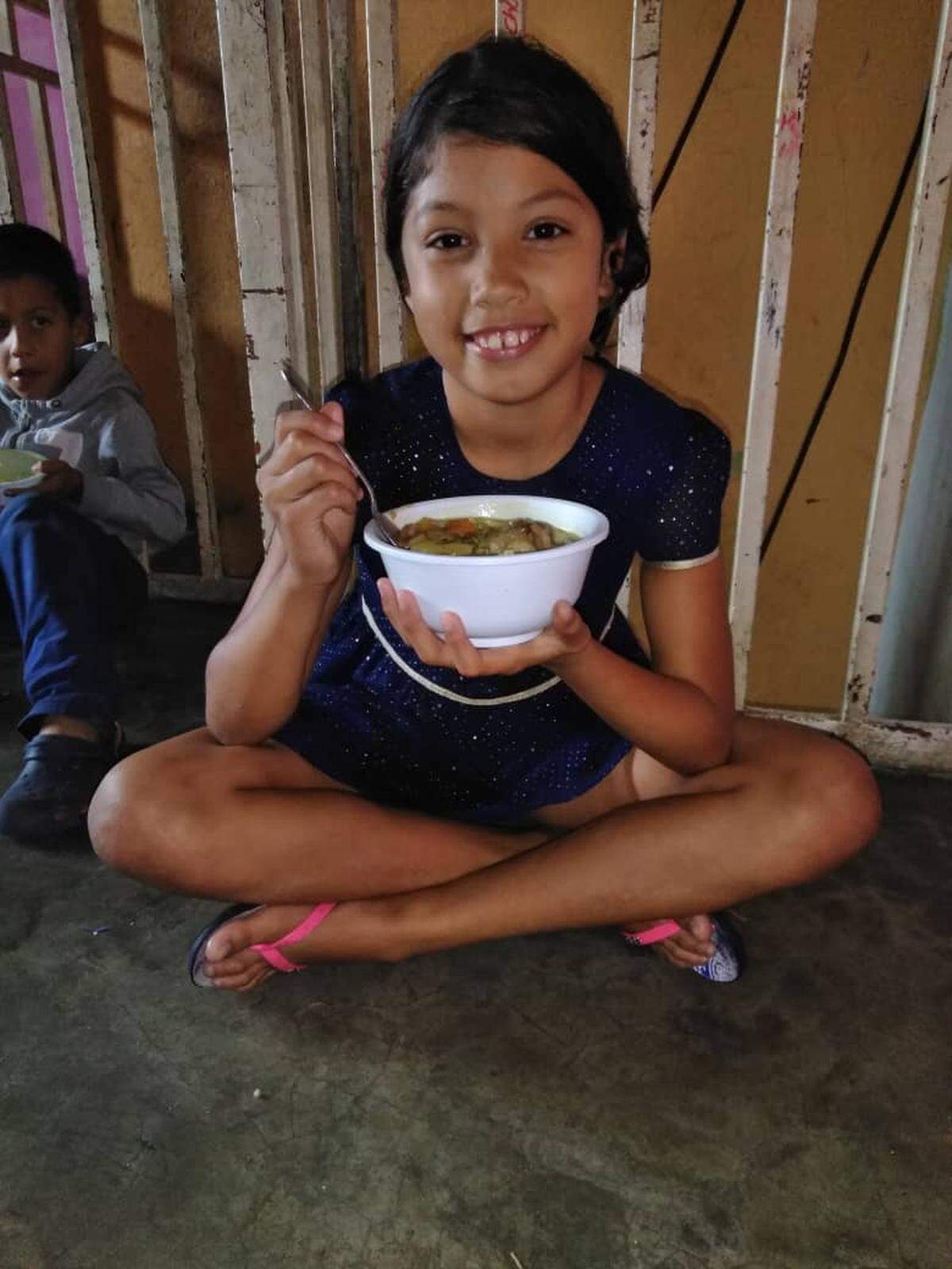 Gilennys Carvallo is one of hundreds of children benefiting from the sale of a chicken soup dish at Obra Kitchen Table in Miami.