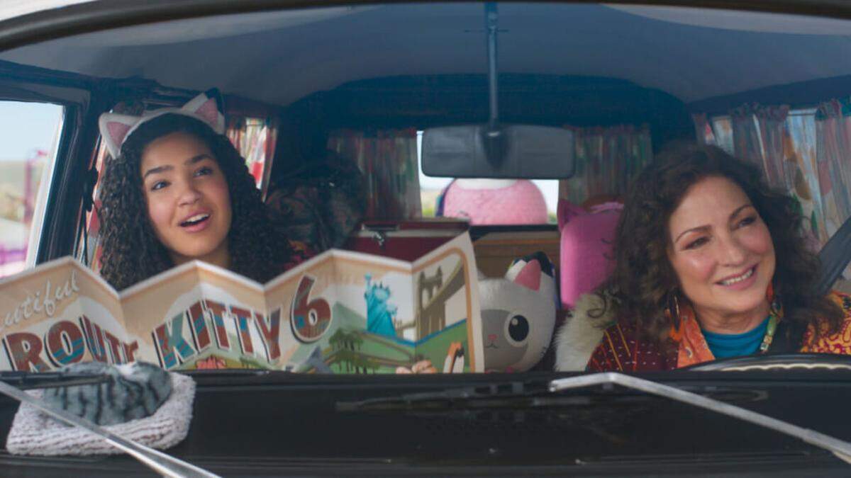 “Gabby’s Dollhouse: The Movie” stars Laila Lockhart Kraner, left, reprising her role from the beloved small screen series and Gloria Estefan as Grandma Gigi as they travel to the urban wonderland of Cat Francisco. The film opens Friday, Sept. 26.