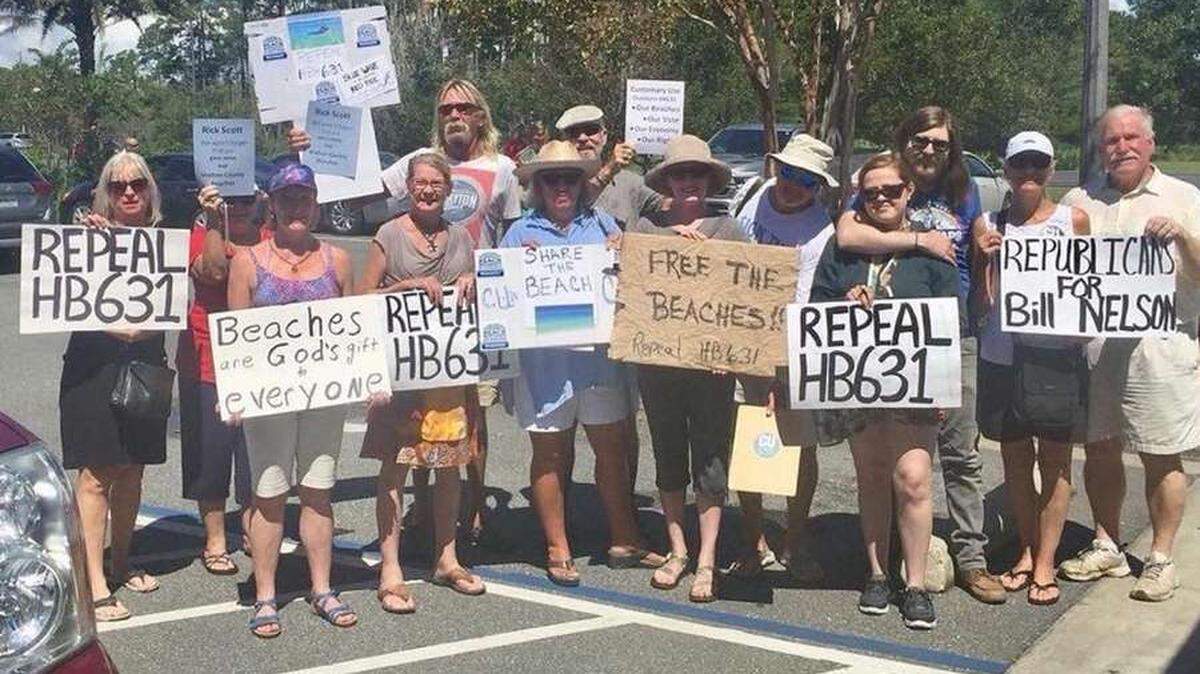 A small group of Walton County Democrats and beach access advocates waited in vain for Gov. Rick Scott in Santa Rosa Beach on Sunday, Sept. 9, 2018.