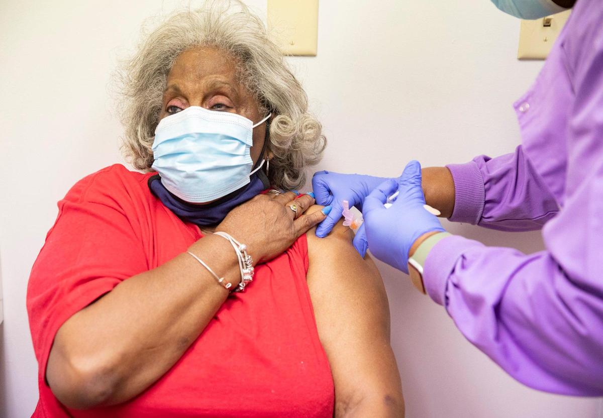 Shirley Kemp of New Beginning Missionary Baptist Church receives her vaccination shot on Friday, Jan. 22, 2021. Jackson Health System has partnered with nearly 55 churches, synagogues and mosques in Miami-Dade County with the goal of reaching people who are age 65 and older in underserved communities.