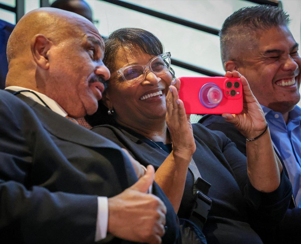Sitting next to his wife, former NBA star and father of Jai Lucas, John Lucas II, left, shares a moment of pride and excitement after his son was introduced by the University of Miami as the new head coach of its men’s basketball program, marking a significant move aimed at revitalizing the team and enhancing its competitive edge in college basketball at UM Lakeside Auditorium on Monday, March 10, 2025, in Coral Gables, Florida.