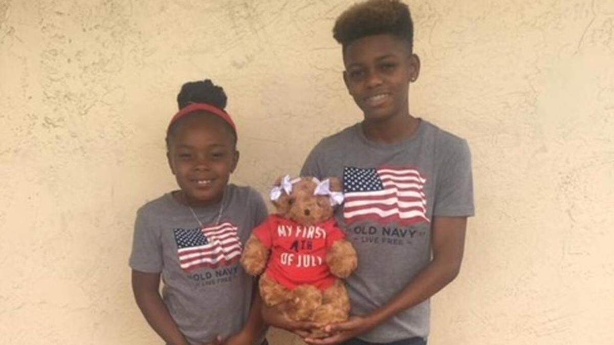 La’Quinta McKinney’s children La’Quan, who is now 14, and La’Breah, 9, hold a teddy bear with the remains of their little sister, La’Vae, who died two years ago.