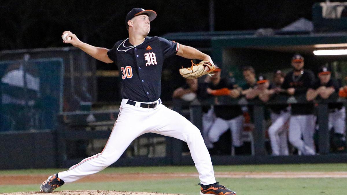 UM Hurricanes pitcher Karson Ligon delivers against Florida Gators on Saturday, March 5, 2022 at Alex Rodriguez Park at Mark Light Field in Coral Gables. Andrew Uloza / for THE MIAMI HERALD