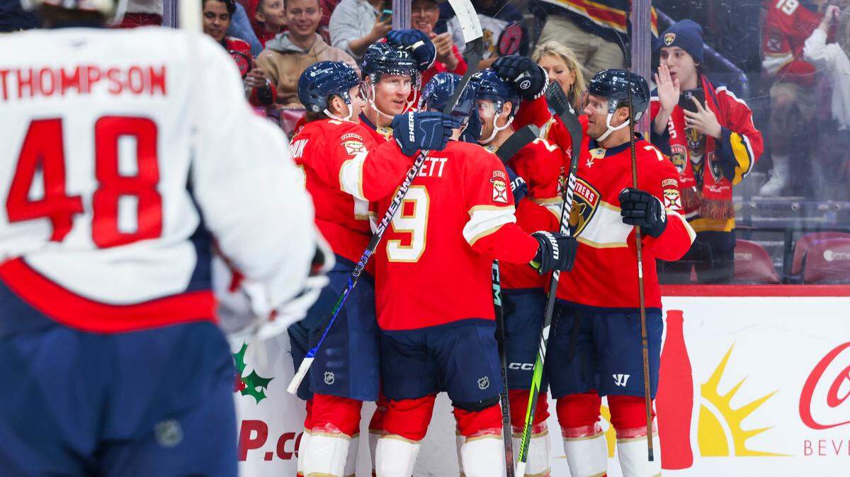 Florida Panthers defenseman Niko Mikkola (77) celebrates his first goal of the season with teammates during the first period of a game on Monday, Nov. 25, 2024, at Amerant Bank Arena in Sunrise, Fla.