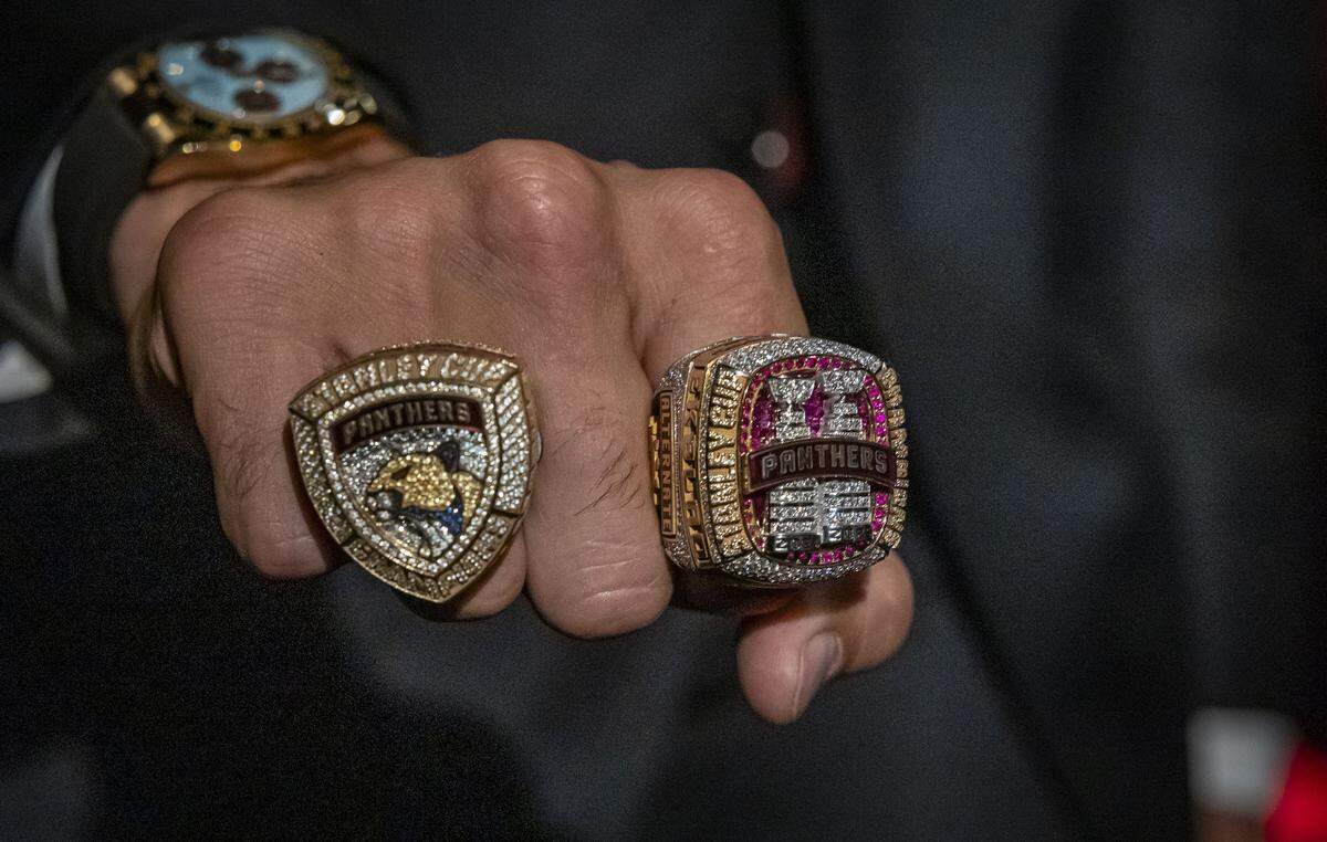 Fort Lauderdale, FL, October 6, 2025 - Aaron Ekblad shows off his rings, last year's, left and this year's right during a private championship ring ceremony at War Memorial Auditorium on Monday, Oct. 6