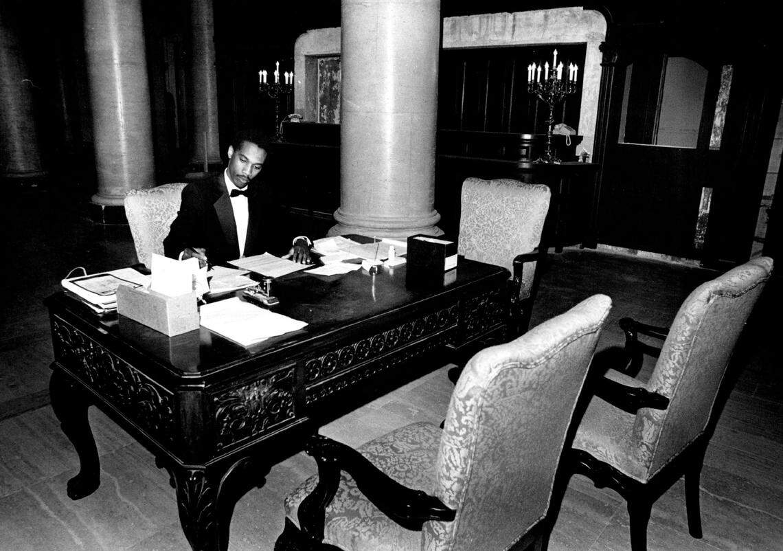 Reginald Laurent, front office supervisor at the Biltmore hotel in Coral Gables, waits for guests in 1987.