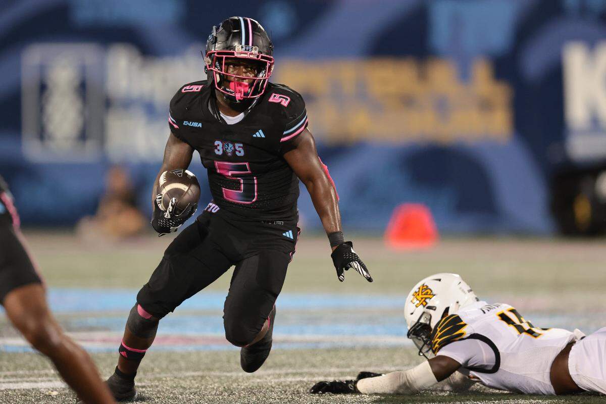 FIU Panthers running back Kejon Owens (5) carries the football for a touchdown against the Kennesaw State Owls during the second quarter at Pitbull Stadium in Miami, Florida, Tuesday, October 21, 2025.