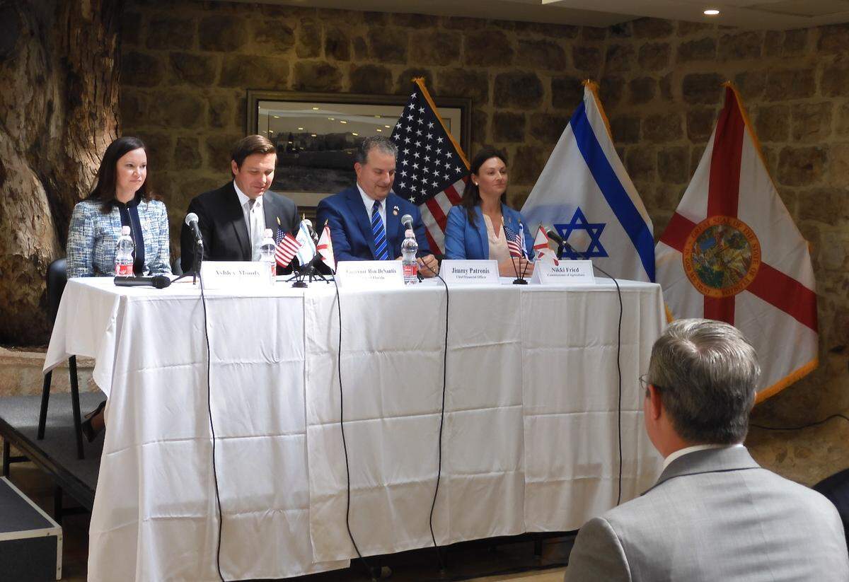 Cabinet members and Gov. Ron DeSantis at the makeshift dais in the Wasson Room of the U.S. Embassy annex in Jerusalem.